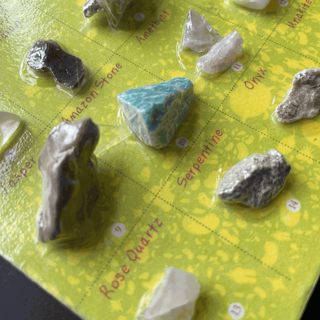 Hand-sized collection of 16 semi-precious Gems of the USA on a labeled 4x6-inch card